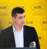AUR anunță că a sesizat Consiliul Concurenței: „Ciucă și Ciolacu vor monopol pe țară”
