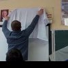 Portretul lui Vladimir Putin dintr-o secție de votare din Voronej a fost acoperit cu un cearceaf, în prima zi a alegerilor prezidențiale din Rusia