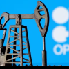 Oil prices slip after OPEC+ extends voluntary oil output cuts until mid-year