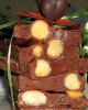 DELICATESE TENTANTĂ Nuci macadamia învelite în ciocolată