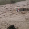 VIDEO Grindină şi inundaţii, în Prahova. Trei autoturisme, luate de viitură